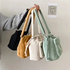 Carry your essentials in style with this cute middle shoulder drawstring bucket bag—a versatile and fashionable accessory for women on the go! -