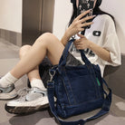 Elevate your casual look with this denim shoulder bag for women. Featuring a large design and zipper closure, this bag is perfect for shopping and everyday use, adding a touch of style to your outfit. -