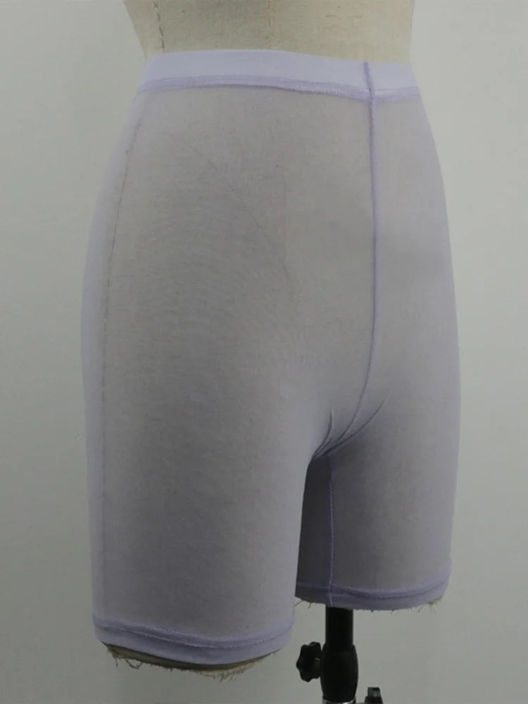 Stay stylish and comfortable with these yellow mesh transparent casual shorts for women—perfect for a fashionable and chic look! -