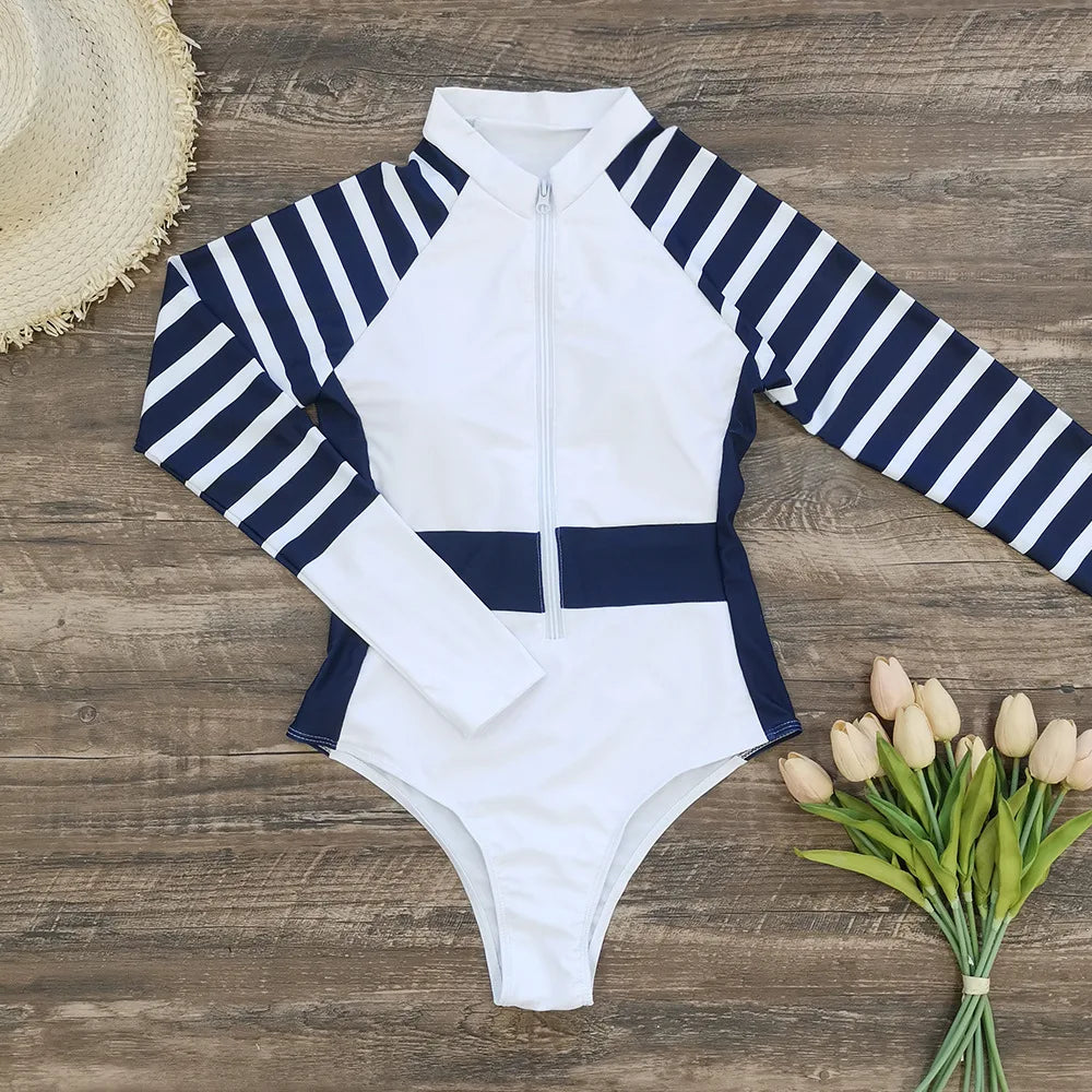 Stay stylish and protected from the sun in this long-sleeved one-piece swimwear for women! -