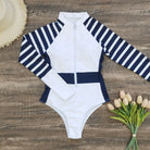 Stay stylish and protected from the sun in this long-sleeved one-piece swimwear for women! -