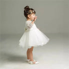 Make your baby girl shine in this elegant long-sleeve white party dress—perfect for special occasions! -