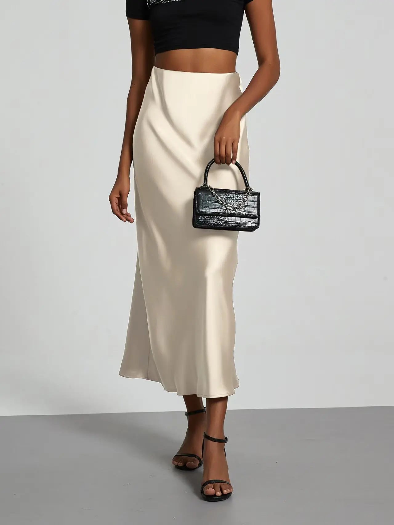 Elevate your elegance with this sleek black satin skirt for women—perfect for any occasion! -