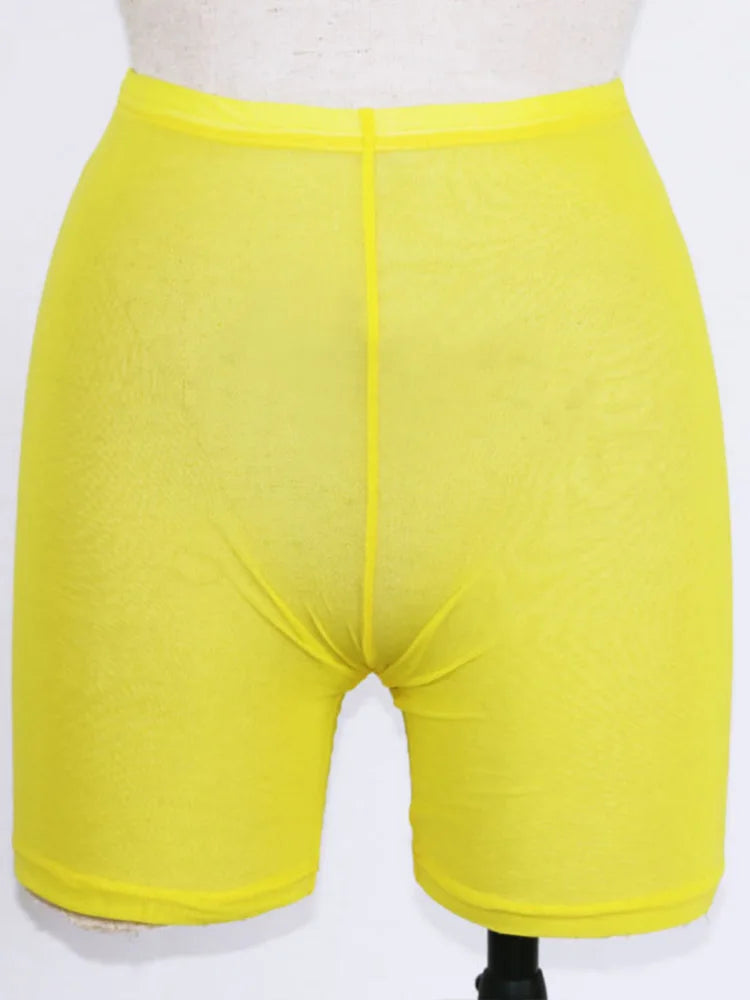 Stay stylish and comfortable with these yellow mesh transparent casual shorts for women—perfect for a fashionable and chic look! -
