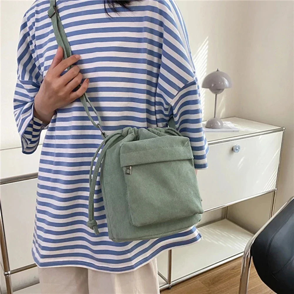 Carry your essentials in style with this cute middle shoulder drawstring bucket bag—a versatile and fashionable accessory for women on the go! -