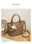 Upgrade your accessories with this new bucket bag for women. Featuring a fashionable and versatile design, this handheld bag is perfect for adding a chic and trendy touch to your look. -