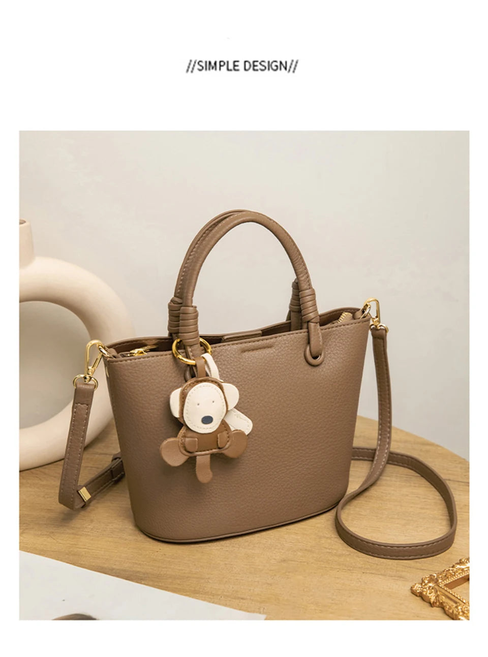 Upgrade your accessories with this new bucket bag for women. Featuring a fashionable and versatile design, this handheld bag is perfect for adding a chic and trendy touch to your look. -