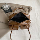Accessorize stylishly with this black shoulder bag for women. This versatile handbag can be carried as a purse or a crossbody bag, making it a chic and practical choice for all occasions. -