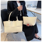 Make a fashion statement with this large capacity handbag. Crafted with stylish woven leather, this tote bag is perfect for adding a touch of elegance to your everyday outfit. -