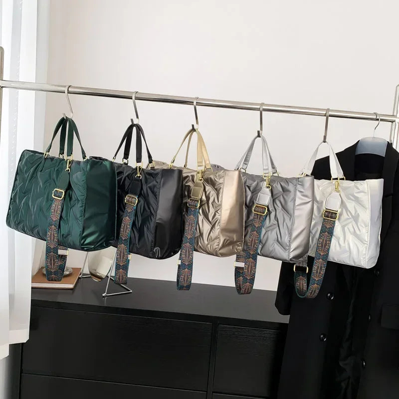Stay on-trend with this fashion-forward large tote padded handbag featuring a designer quilted design. This stylish accessory is perfect for adding a touch of sophistication and elegance to your ensemble. -