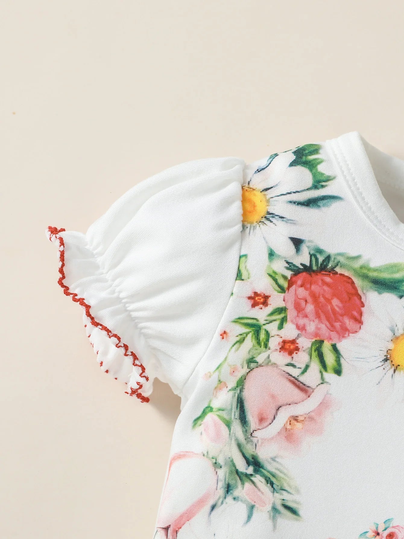 Keep your baby girl comfy and cute with this short sleeve romper featuring fun cartoon designs! -