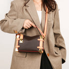 Make a statement with this luxurious and elegant box bag for women. Crafted from high-quality leather, this shoulder handbag features an elegant top-handle design, exuding sophistication and style for a classy finishing touch to your ensemble. -