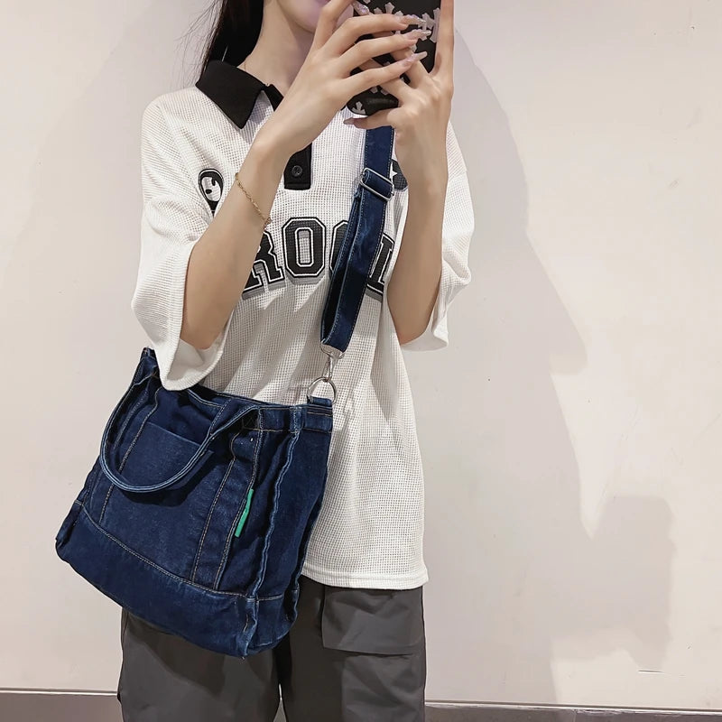 Elevate your casual look with this denim shoulder bag for women. Featuring a large design and zipper closure, this bag is perfect for shopping and everyday use, adding a touch of style to your outfit. -