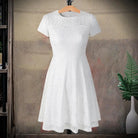 Make a chic statement with this elegant women's dress featuring an O-neck design, transparent lace, and hollow detail—a perfect choice for a sophisticated and stylish look. -