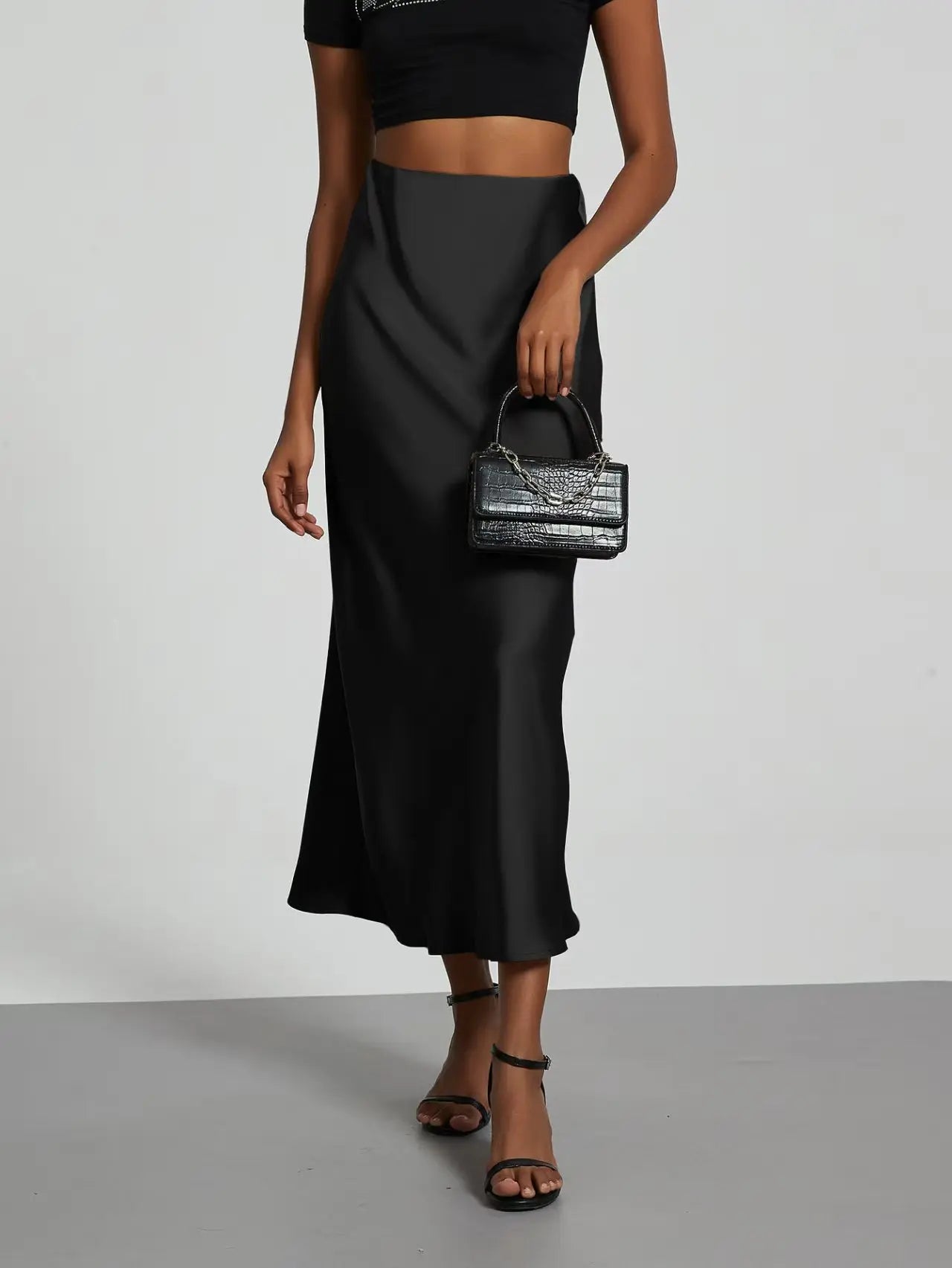 Elevate your elegance with this sleek black satin skirt for women—perfect for any occasion! -