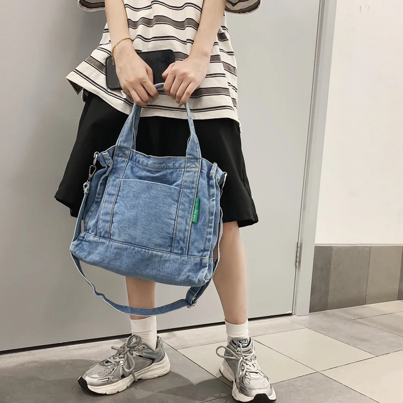 Elevate your casual look with this denim shoulder bag for women. Featuring a large design and zipper closure, this bag is perfect for shopping and everyday use, adding a touch of style to your outfit. -