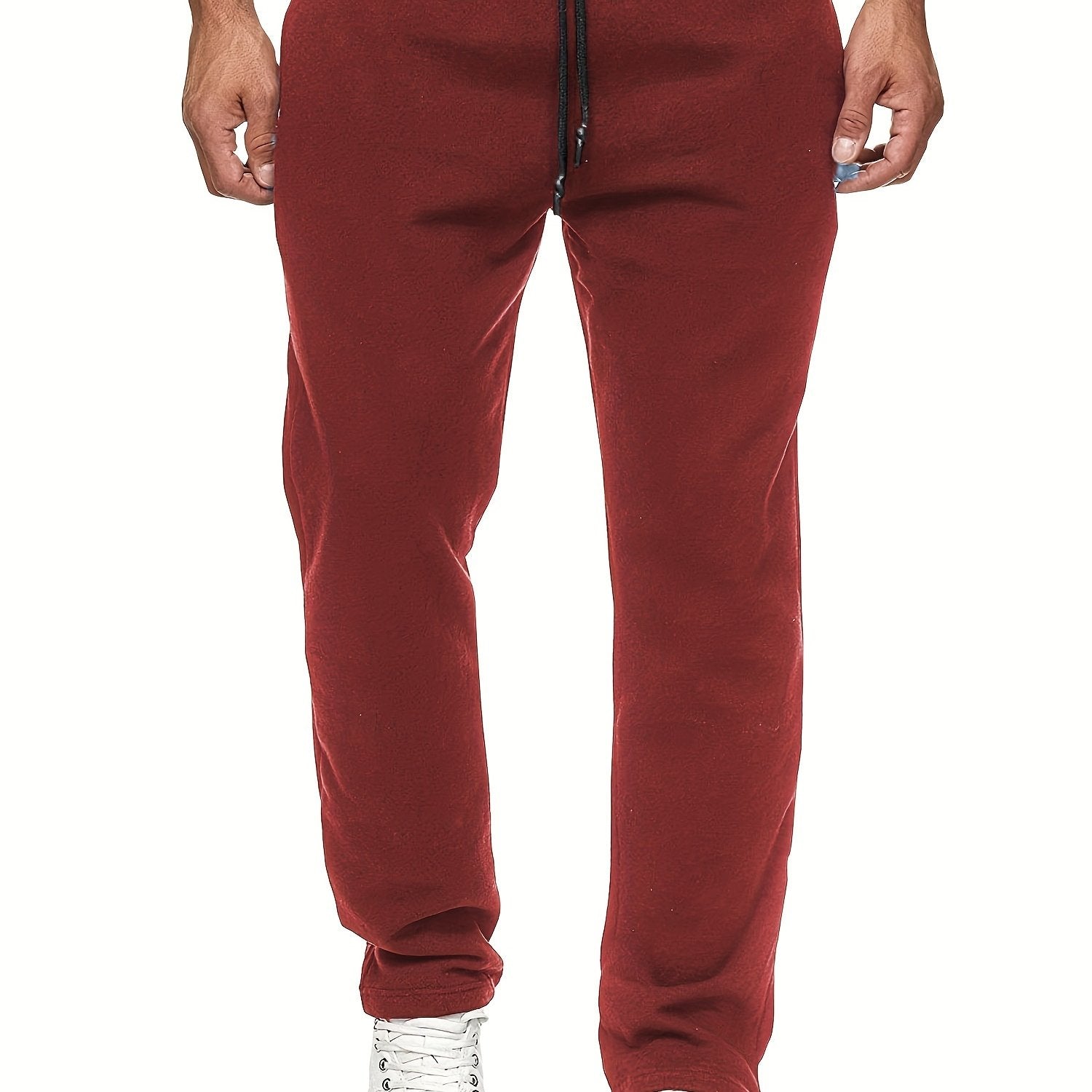 Stay comfy and warm in these men's solid color fleece-lined joggers! -