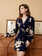 Rock an elegant look in this V-neck belted dress with a stylish floral print! -
