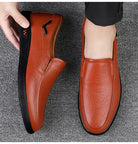 Step into comfort and safety with these men's genuine leather slip-on, slip-resistant shoes! -