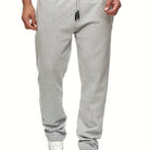 Stay comfy and warm in these men's solid color fleece-lined joggers! -