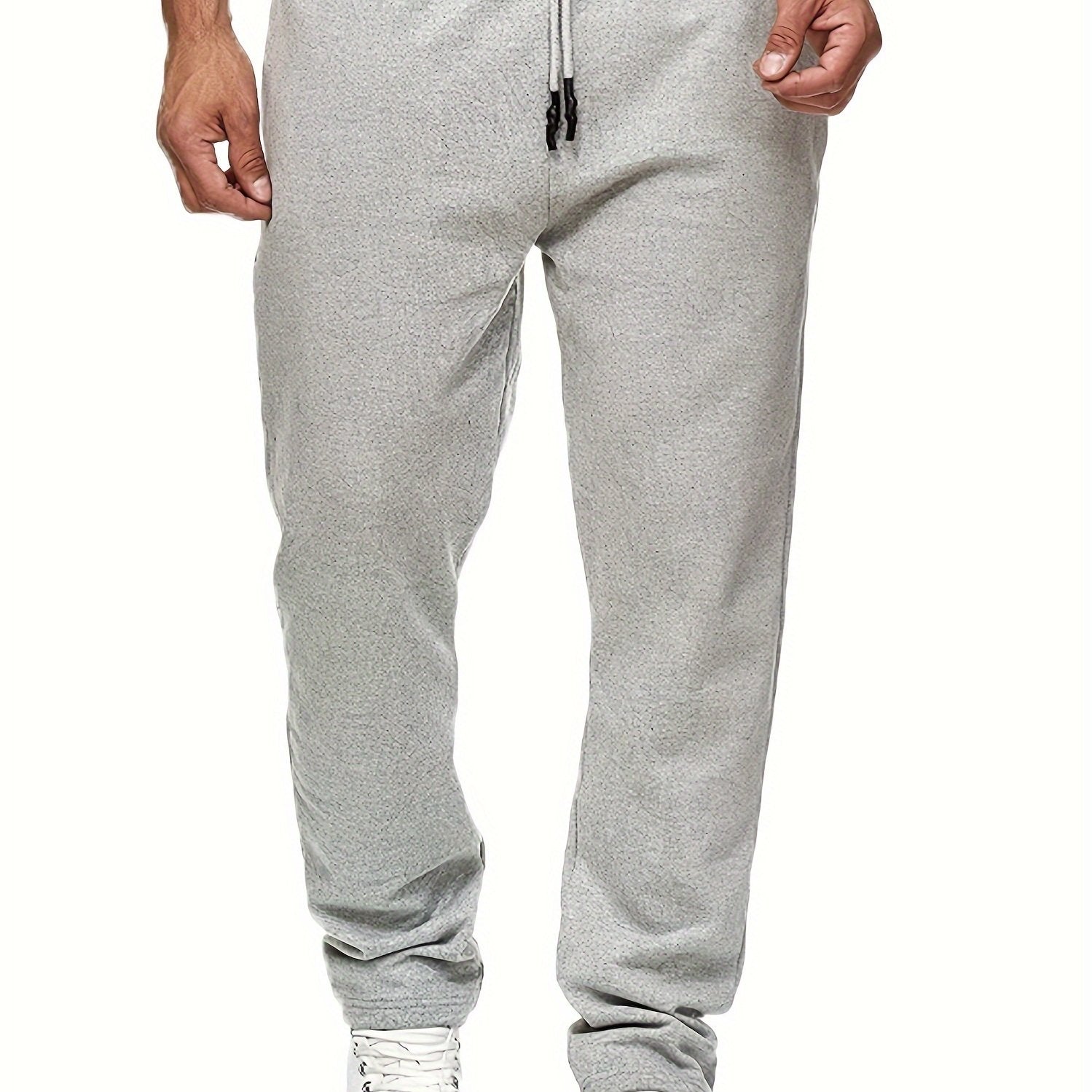 Stay comfy and warm in these men's solid color fleece-lined joggers! -