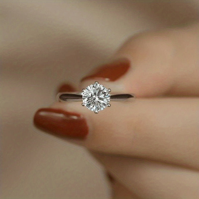 Sparkle bright with this women's one-carat silver moissanite ring! -