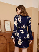 Rock an elegant look in this V-neck belted dress with a stylish floral print! -