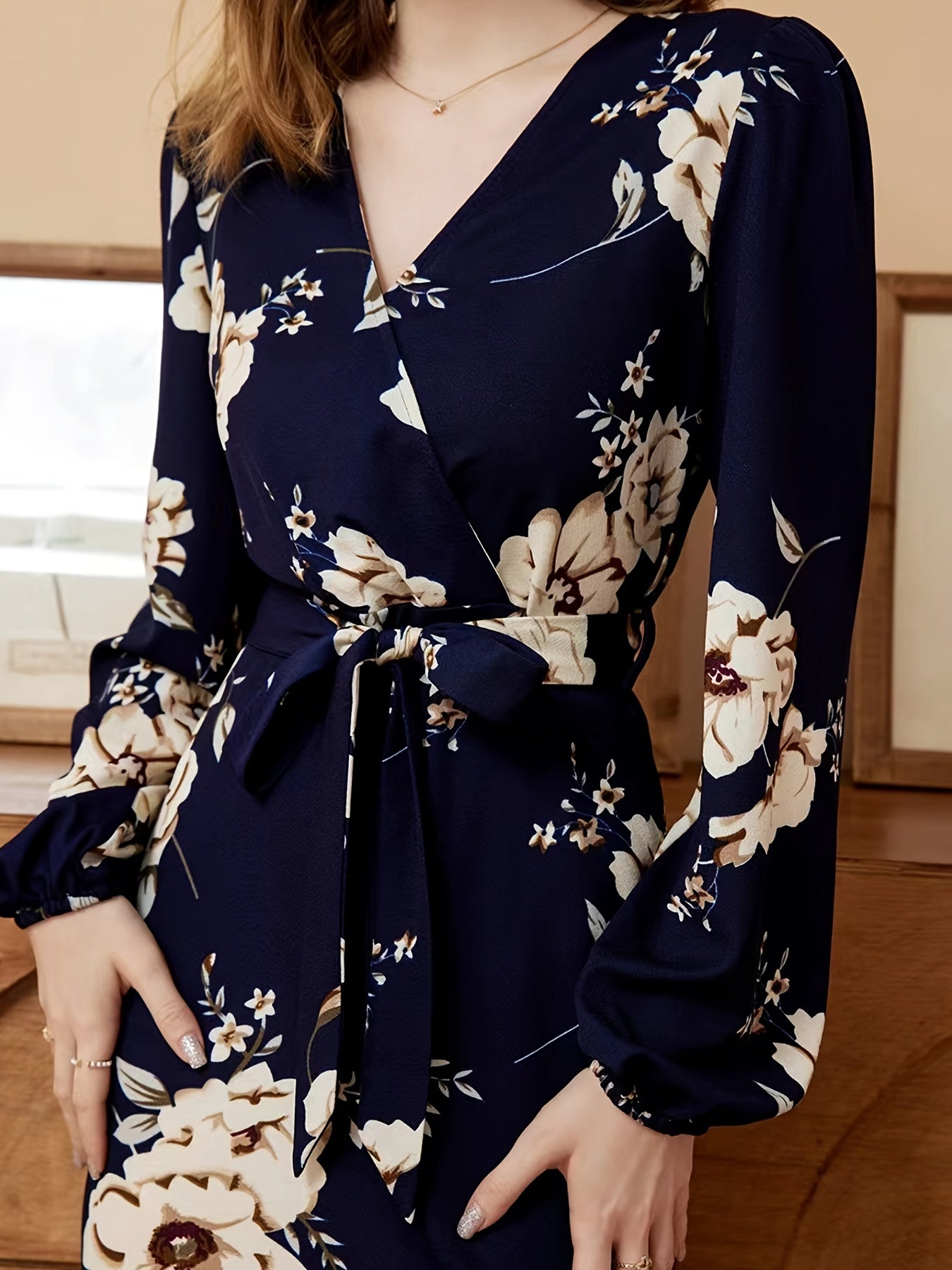 Rock an elegant look in this V-neck belted dress with a stylish floral print! -